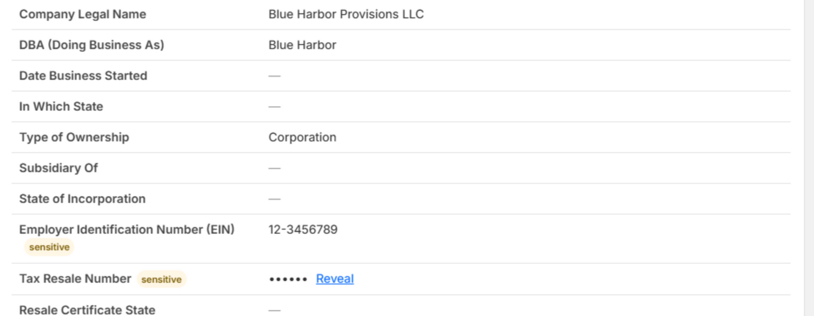 The same values after clicking Reveal on the EIN: its value is shown while the Tax Resale Number stays masked